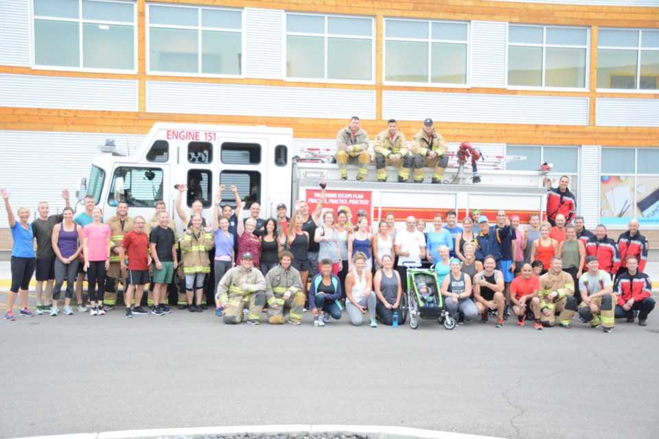 The workout crew huddles for a group photo before sweating it out.