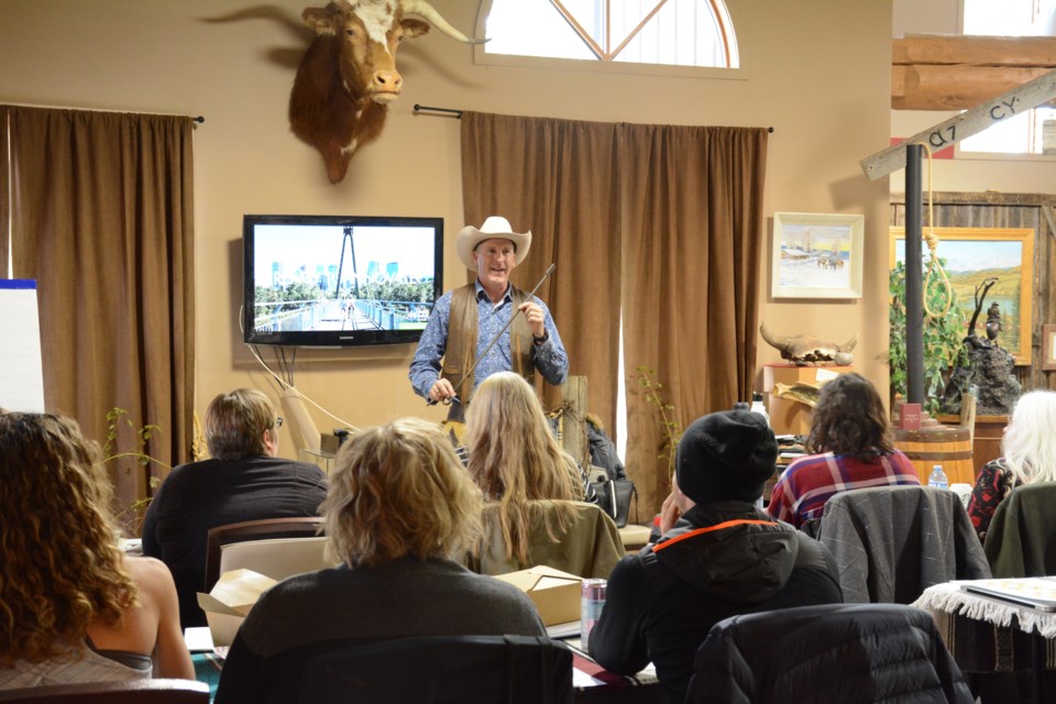 Executive Director at Stockmen's Memorial Foundation, Scott Grattidge holds up a brand at the Experience Essentials workshop. 