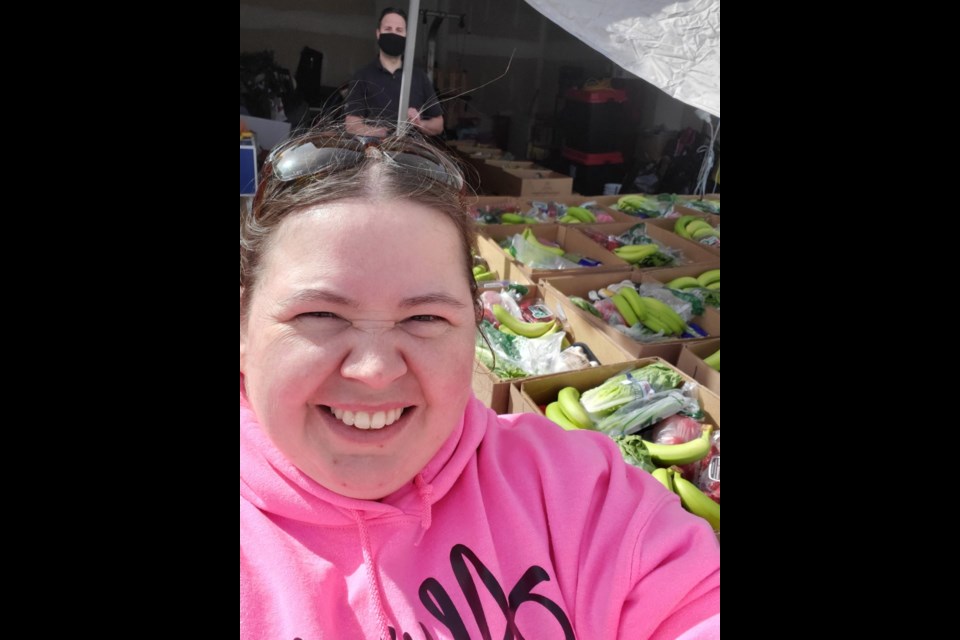 Crystal Kerr poses with her Good Food Box orders outside her Cochrane home. Submitted photo.