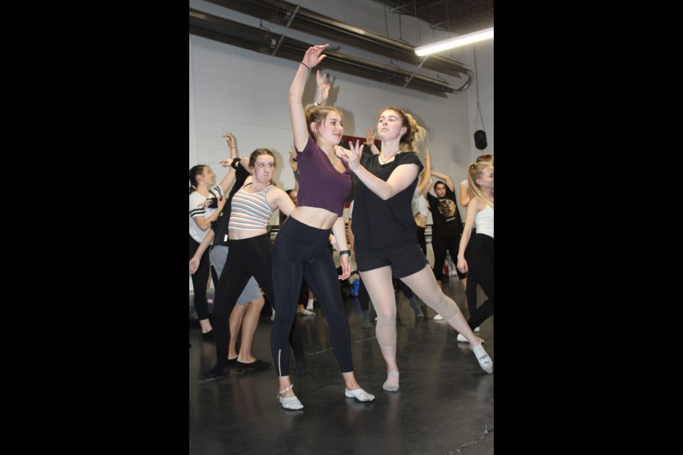  Jill (stripe), Ava (purple) and Paige  practise their moves. 