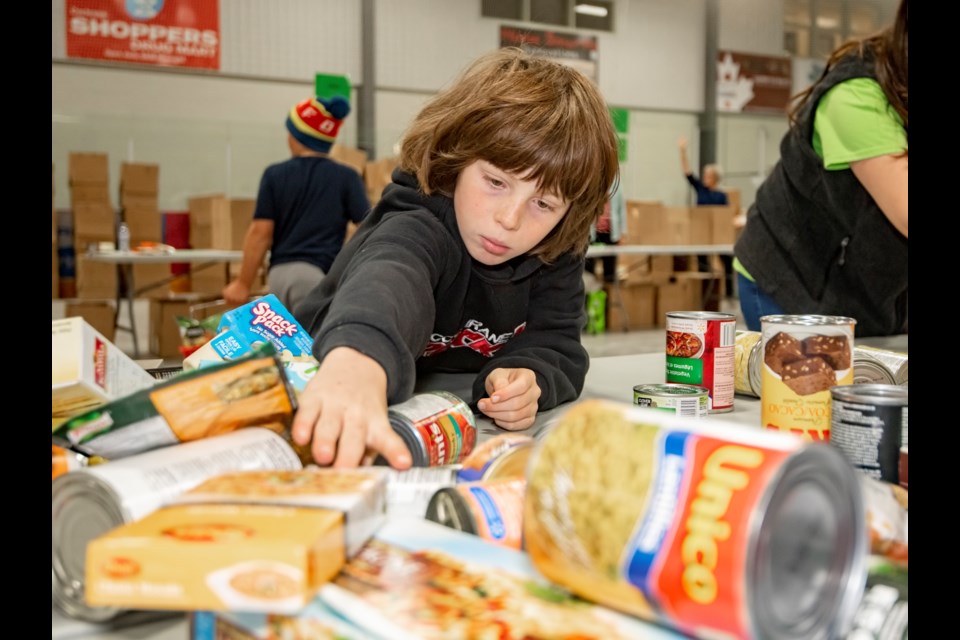 The Helping Hands Society of Cochrane and Area is hosting a food drive in the community's north neighbourhoods and surrounding area Sept. 17. It will be the third of its quarterly food drives this year and is coming shortly after a University of Toronto study found Alberta to have the highest prevalence of household food insecurity in Canada. (File Photo/Cochrane Eagle)