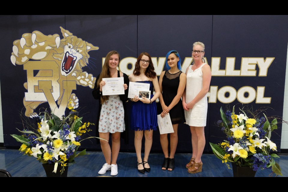 Bow Valley High School's cheer team award recipients: Jordan Pohl (Most Valuable Participant), Charlotte Vos (Rookie), Kirstin Cinnamon (Heart Award), Staff Coach Tara Miller-Plouffe (Missing: Shayla Brass, Coaches Maya and Emma Griscowsky).


