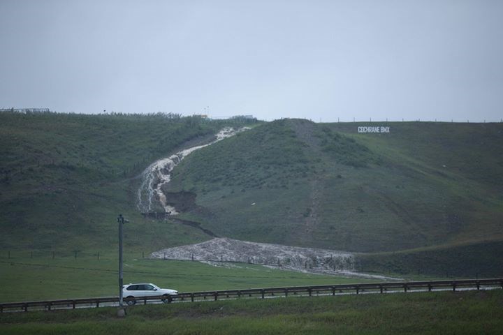This dramatic shot shows erosion on the hill where the Ag Society sign is creating a waterfall cascading toward the highway. Photo Courtesy of Shaun Arnsten.