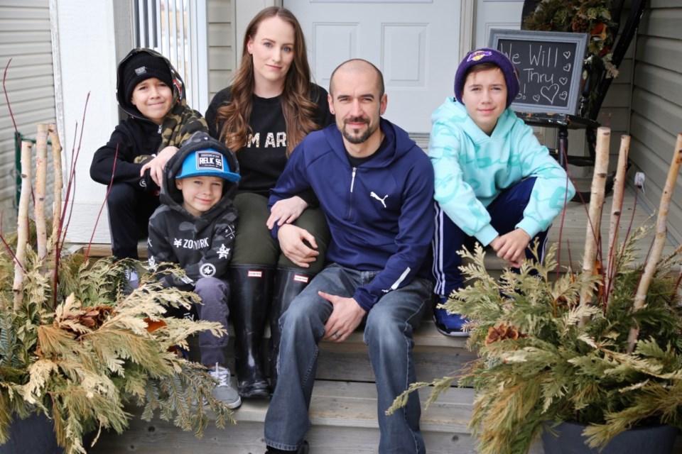 Jennifer Spackman and her family pose for their own porch portrait. 

Submitted photo