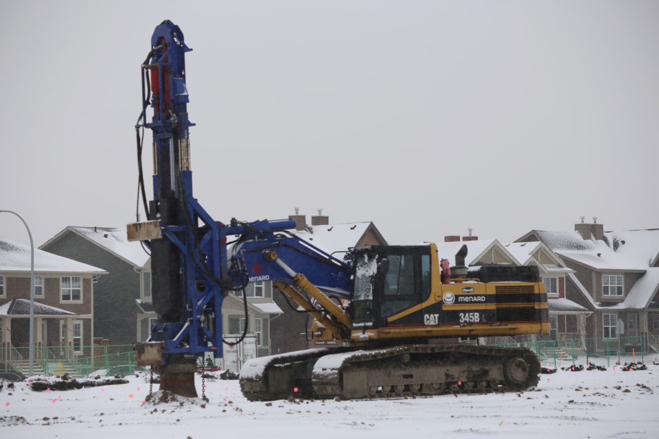 A large piece of machinery at the construction site of the Fireside School has sat unmoving since CANA was made aware of the damages. (Tyler Klinkhammer/The Cochrane Eagle)