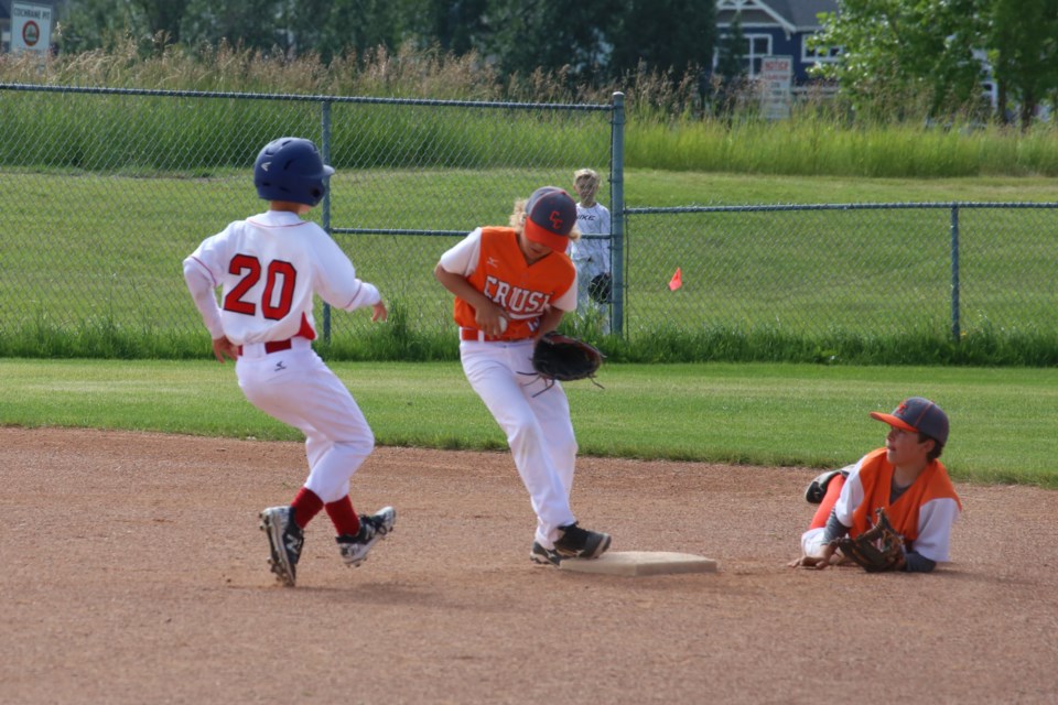 Shortstop Riley Boychuk made a diving catch and toss to second baseman, George Evans, scoring an out for the Crush. (Tyler Klinkhammer/The Cochrane Eagle)