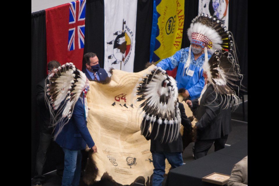 Premier Jason Kenney, Minister of Indigenous Relations Rick Wilson, Bearspaw First Nation Chief Darcy Dixon, Chiniki First Nation Chief Aaron Young, Wesley First Nation Chief Clifford Poucette and Tsuut'ina Nation Roy Whitney sign The Alberta-Stoney Nakoda-Tsuut'ina Tribal Council Protocol Agreement  on Friday (Oct. 2) at the 7 Chiefs Sportsplex in Tsuut'ina Nation. CHELSEA KEMP COCHRANE EAGLE PHOTO