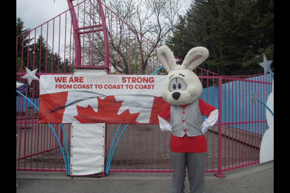 Jack Bunny stands beside a Calaway Park ride. Calaway Park Photo