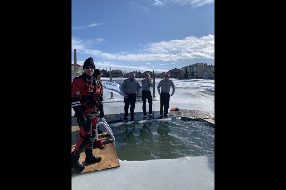 Cochrane RCMP Constables Nathan Moore, Bonnie Sauve and Clayton Gelinas lept into Arbour Lake in Calgary on Saturday (Feb. 22) to raise money for Special Olympics Alberta. Submitted photo