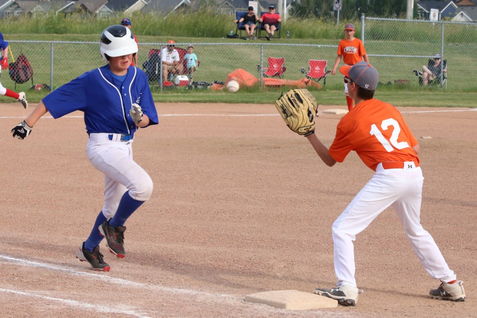 The Centennial player ran fast, but not fast enough to beat the ball to first. #12, Owen Pike made a great catch to get an out for his team.