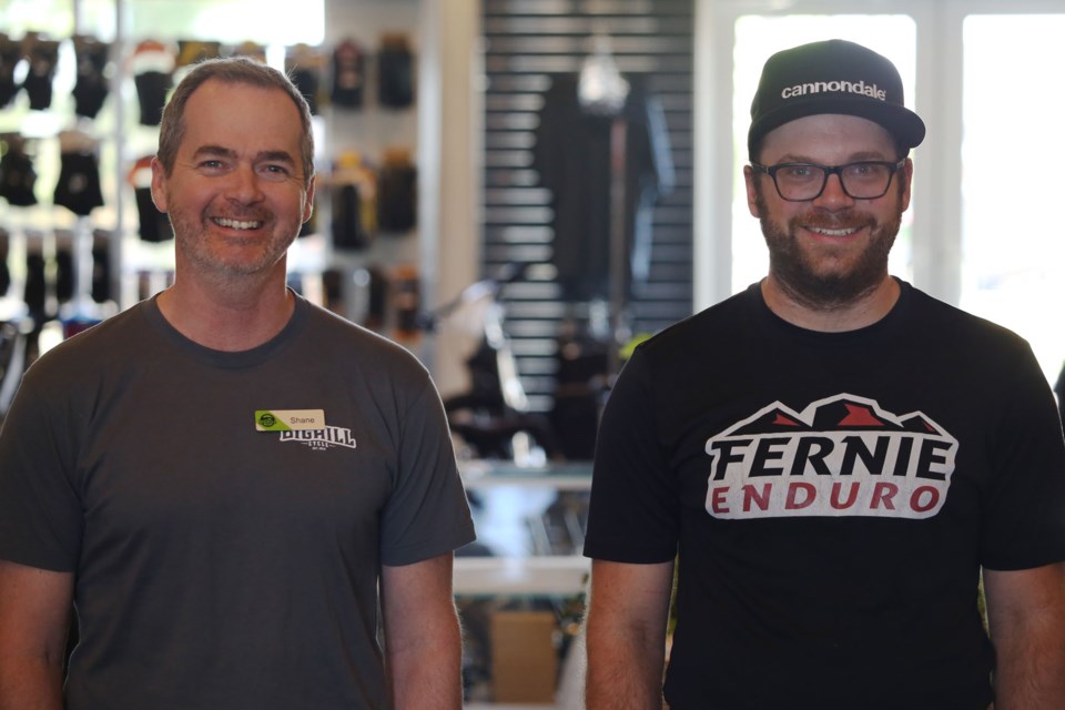 The co-founders of Big Hill Cycle, Shane Campbell (left) and Tim Lomenda pose for a photo. (Tyler Klinkhammer/The Cochrane Eagle)