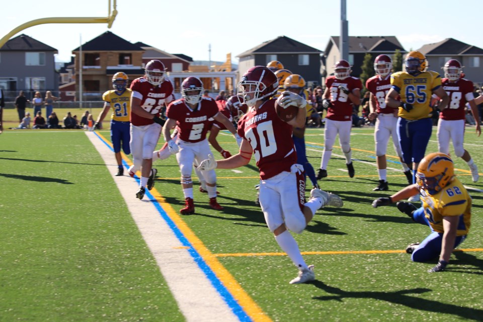 Ethan Clazie finds a clear route to the endzone on Friday (Sept. 3) at the field behind Bow Valley High School. (Tyler Klinkhammer/The Cochrane Eagle)