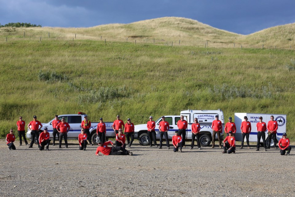 Twenty-five members of Cochrane Search and Rescue posed for a photo at a training exercise on Thursday (Aug. 13) at the Cochrane and District Ag Club. (Tyler Klinkhammer/The Cochrane Eagle)