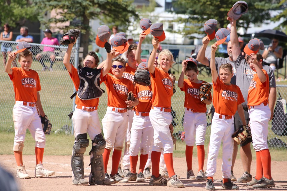 The Cochrane Crush remove and wave their hats after a game. (File Photo)