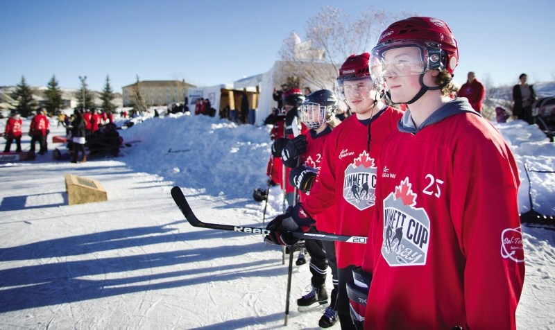 Talus Hume, right, and his team watch and wait for a line change.