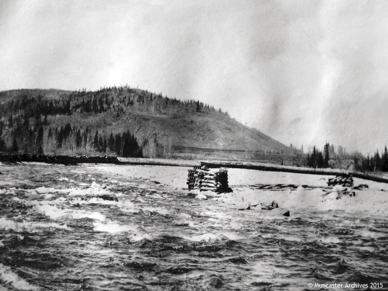 The first bridge over the Elbow River was taken in 1914 by Mary Burby.