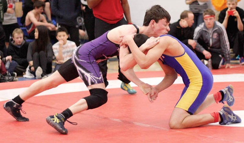 St. Timothy High School Thunder wrestler Luke Clubb grapples in bronze-medal match at Winston Churchill open in Calgary. Leading 6-5 in the second round, Clubb got caught