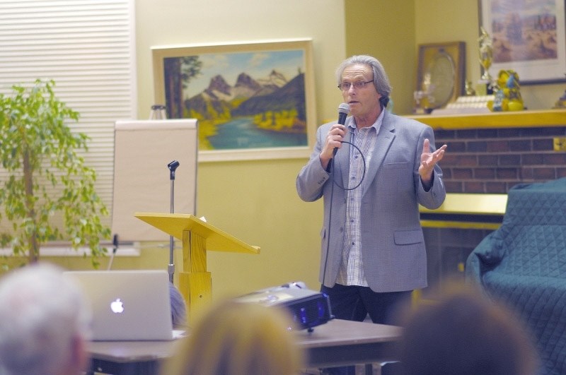 Rocky View County councillor Jerry Arshinoff speaking to Springbank residents at a town hall meeting Oct. 21, 2014.