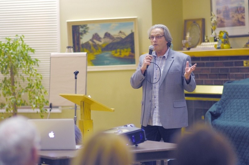 Rocky View County councillor Jerry Arshinoff speaking to Springbank residents at a town hall meeting Oct. 21, 2014.