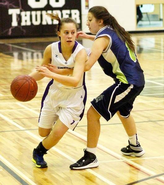 St. Timothy High School Thunder varsity girl&#8217;s point guard Aaneli Zemlak (left) has received a $200 Shooting Stars basketball scholarship.