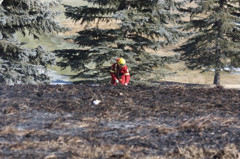 Rocky View County Fire Services douces a grass fire at the Bearspaw Farmers&#8217; Market location March 9.