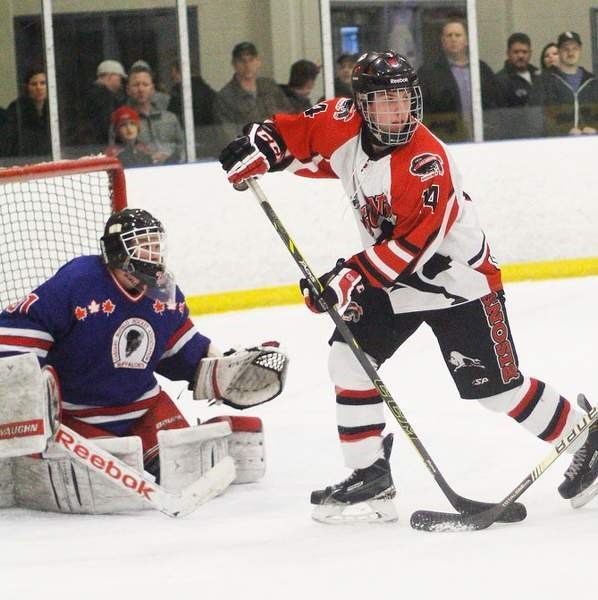 UFA Bisons forward Kyle Gordon of Cochrane sets up in front of Calgary Buffaloes goalie Mike Barabash in Alberta AAA Midget Hockey League Chrysler Div. final play March 8 in