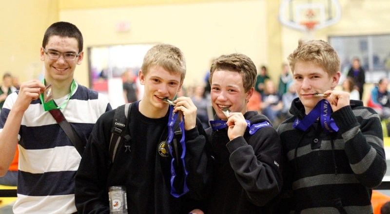 Cochrane Cowboys (from left) Connor Swedlo, bronze, Connor McNeice, gold, and Brendan McKeage, gold, show off the provincial medals they won in the Cadet boy&#8217;s division 