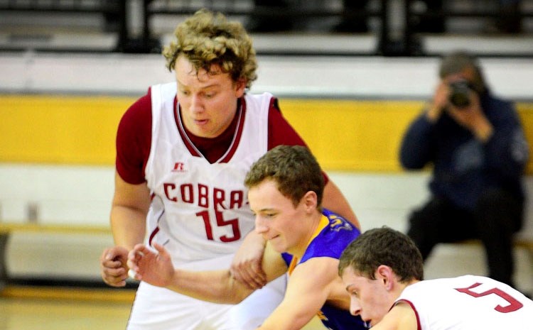 Cochrane High School Cobras two-sport (football/basketball) athlete Brock Wiebe (left) goes for the ball with teammate Jake Nielson. A year since being diagnosed with Hodgkin 