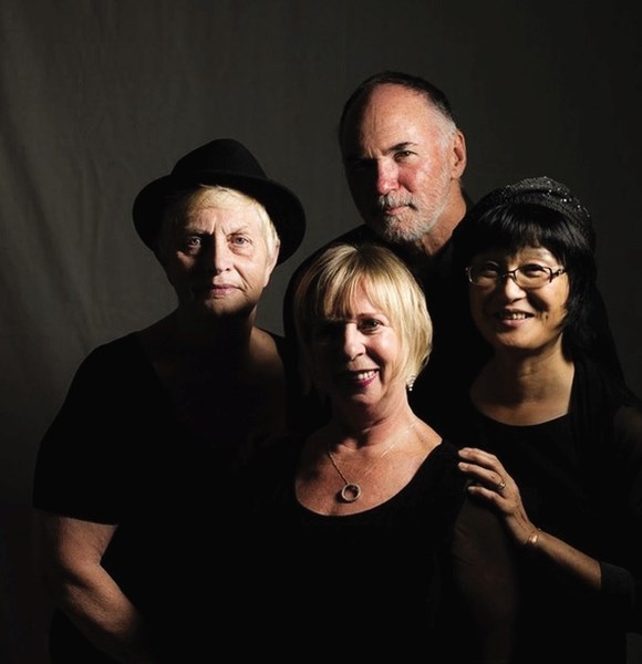 From left clockwise: Sue Anne Borer, auto harp and percussion; Tim Babey, mandolin and guitar; Renay Eng-Fisher, upright bass; Sandy Hirth, guitar.
