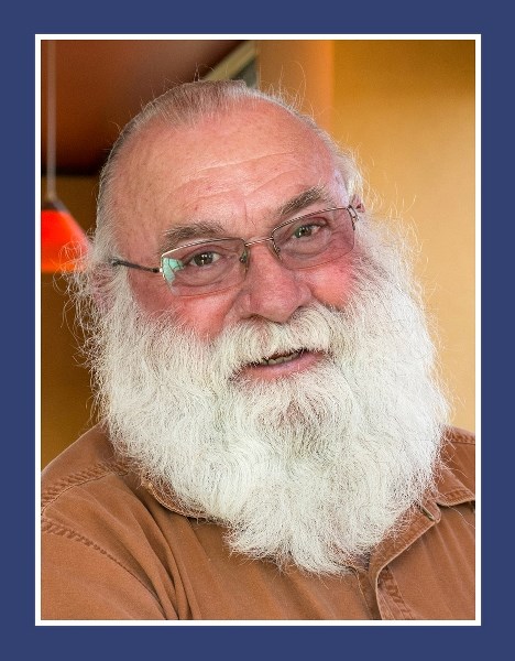 John Hatch, ostrich farmer, prosthetist and my new bearded buddy, served me a cup of Light.