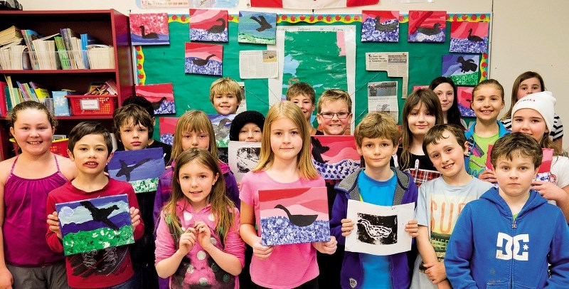 Elizabeth Barrett Elementary School students show artwork they created to auction off for Ducks Unlimited Canada.