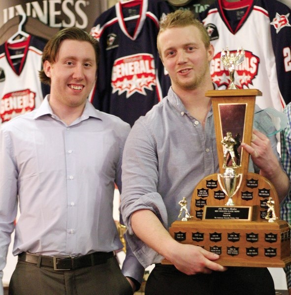Cochrane Generals head coach Evan McFeeters (left) presents Craig Packard with the team&#8217;s Top Defenceman award at the team&#8217;s season-ending banquet March 27 at