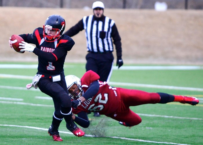 Cochrane Lions linebacker Justin Sambu makes a tackle in Calgary Area Midget Football Association Week 1 play against Airdrie&#8217;s Northern Raiders on April 1 at