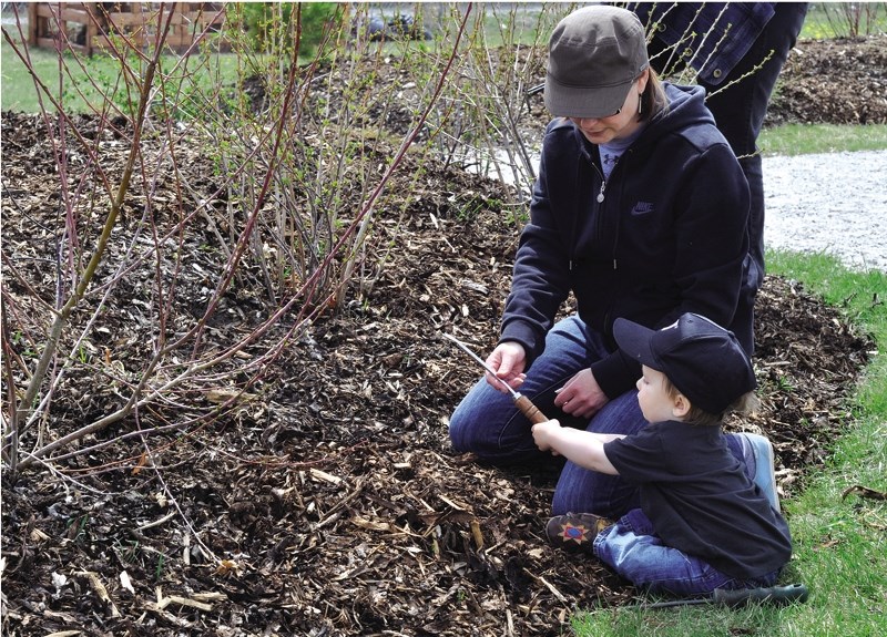 Kelly Learned and her son Benjamin at the community garden at Glenbow School in 2011.