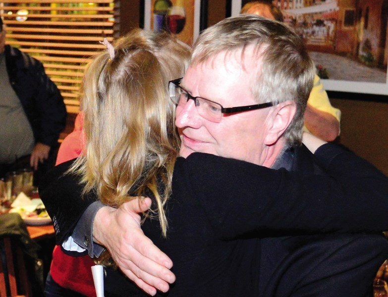 Wildrose candidate Scott Wagner hugs his daughter Emma after coming in second in the Alberta election May 5.