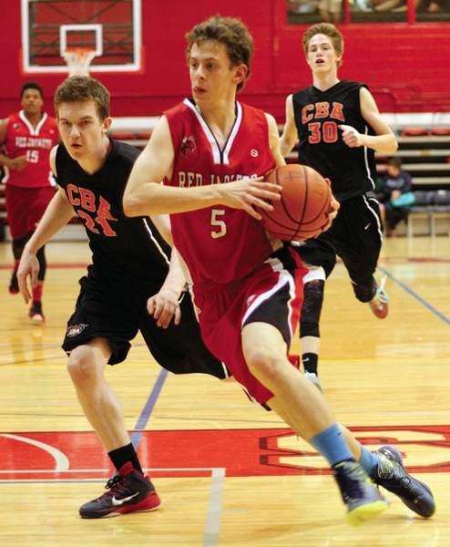 Cochrane Red Jackets guard/forward Jake Nielson drives into the paint vs. CBA in under-17-year-old (U17) boy&#8217;s play at Genesis Classic hoops tourney May 16 in Calgary.