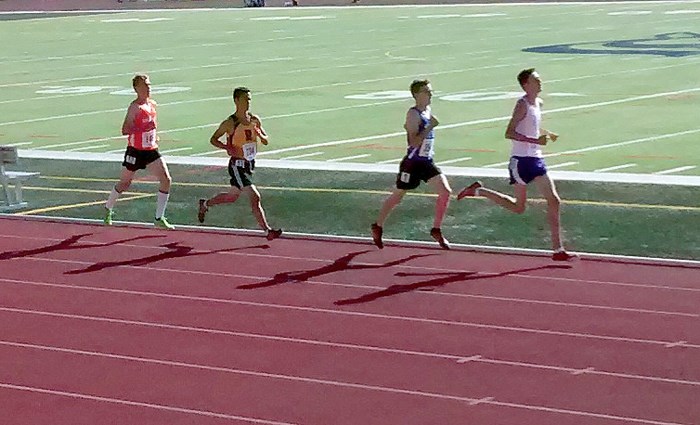 St. Timothy High School Thunder runner Alex Howells leads a pack of runners down the track in the Alberta Schools&#8217; Athletic Association track provincials junior