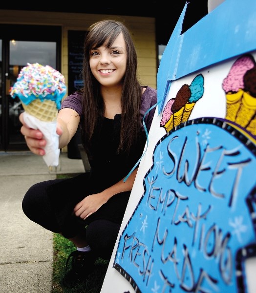 Megan Camba from Sweet Temptations shows off just one tasty treat from the downtown shop, which won gold in the Eagle&#8217;s Best of Cochrane survey for Best Place to Feed a 