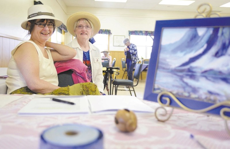 Laura Procunier, left, and Wendy Adams at Beaupre Community Hall during last year&#8217;s Beaupre Artists&#8217; Guild Show and Sale.