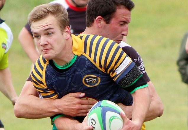 Bow Valley Grizzlies fullback James Patterson bulls through tacklers in Calgary Rugby Union Second Division men&#8217;s play vs. Calgary Saracens on June 13 in Cochrane. In