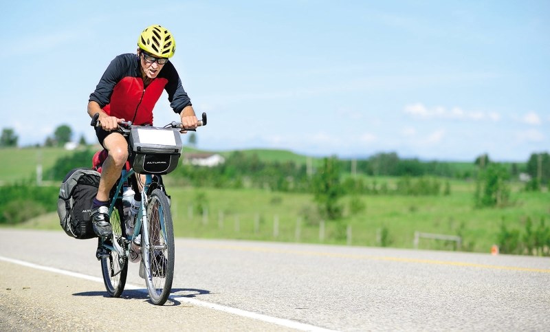 British cyclist John Baxter, 73-years-young, makes his way across Canada and through Cochrane June 24. Baxter started his journey in Vancouver and hopes to make it to St.