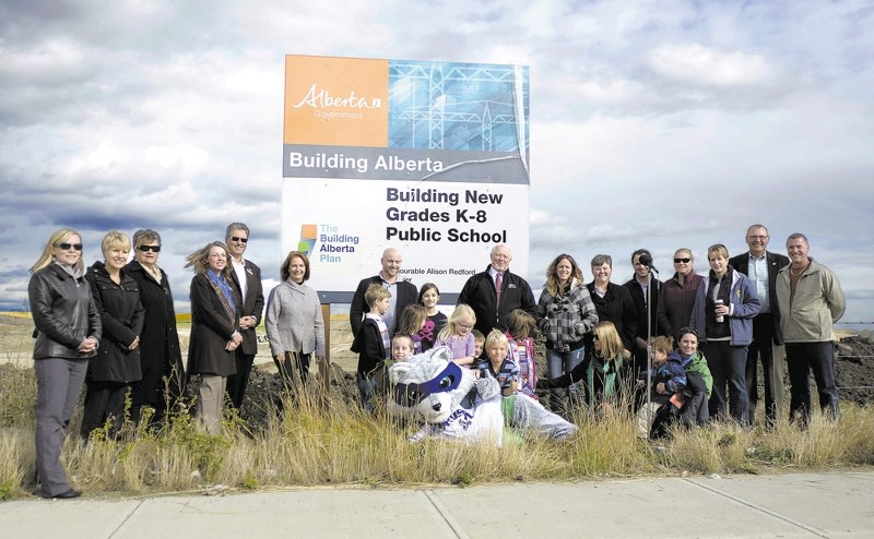 Public officials mark the announcement of the new school in Sunset Ridge October 2013.