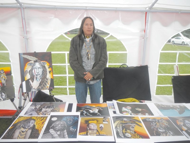 Artist Kalum Teke Dan at the Aboriginal Day celebration in Redwood Meadows.