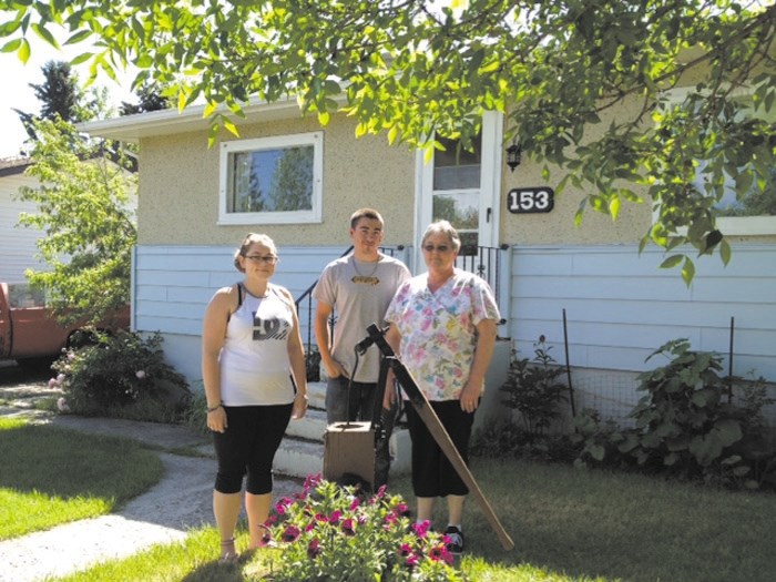 From left: Charlotte, James Jr. and Leona Toner at their Cochrane home.