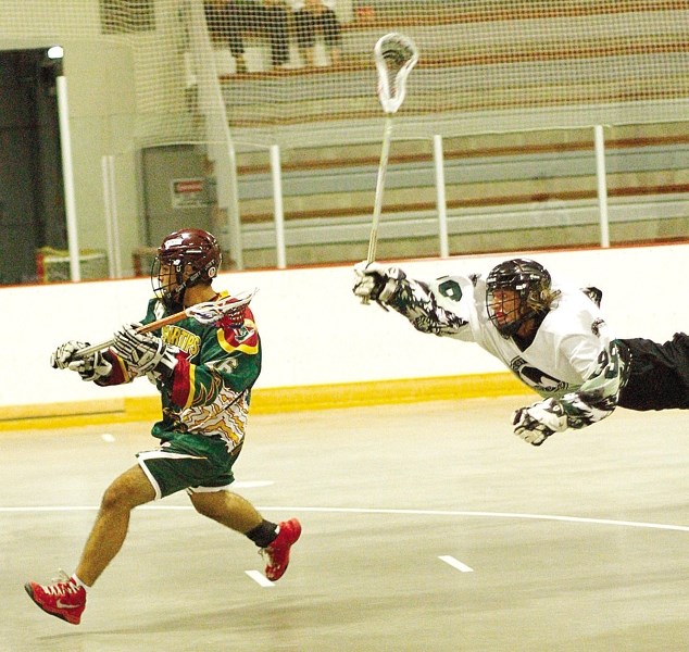 Okotoks Marauders&#8217; Caden Brodick-Wise dives to catch Rockyview Silvertips&#8217; Levi Strandquist in Rocky Mountain Lacrosse League Tier 1 Jr. B action July 4 at