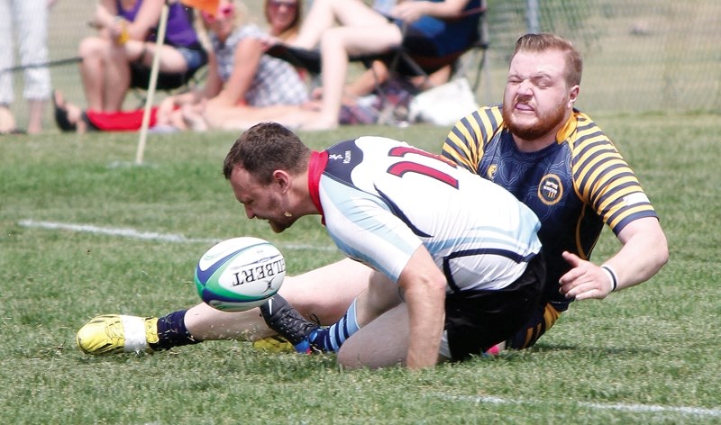 Bow Valley Grizzlies&#8217; Ben Mayo stops Calgary Canucks ball carrier in his tracks during Calgary Rugby Union Second Division men&#8217;s play July 11 in Calgary.