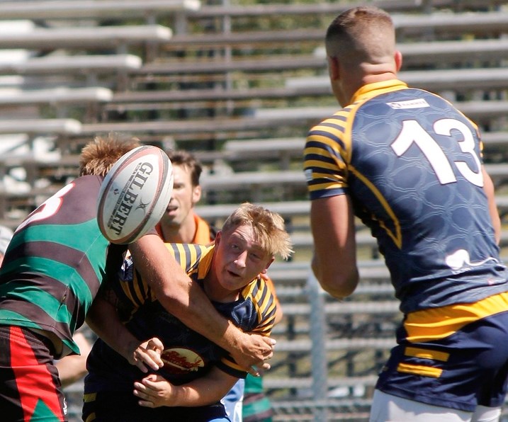Bow Valley Grizzlies fly half Isaac Townsend takes a shot after firing a pass to Dave Evans in Calgary Rugby Union Second Division men&#8217;s play vs. Calgary Saracens on