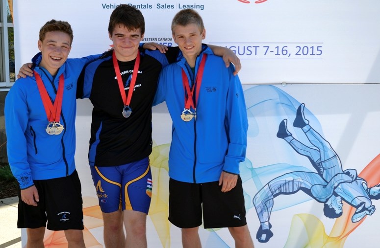 Cochrane Cowboys wrestlers (from left) Brendan McKeage, Connor Pointen and Connor McNeice display the medals they won for Team Alberta on Aug. 11 at the Western Canada Summer 