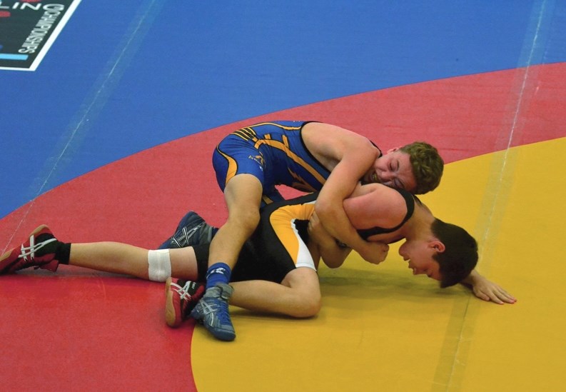 Cochrane Cowboys wrestler Brendan McKeage wrestles at the Western Canada Summer Games in Wood Buffalo. He won a silver medal at the Games on Aug. 11 despite wrestling with a