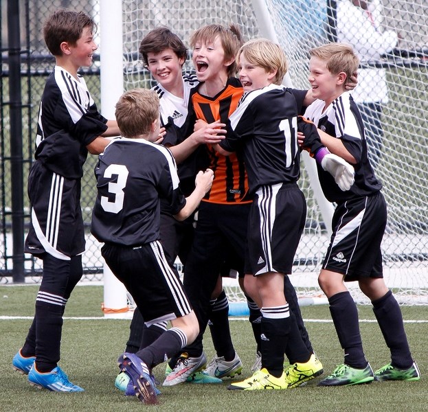 Cochrane Attacking Wolves mob &#8216;keeper Sam Finley after winning the Alberta Soccer Outdoor Provincial Championships U12 Tier 3 boy&#8217;s title with a gripping 2-1 win